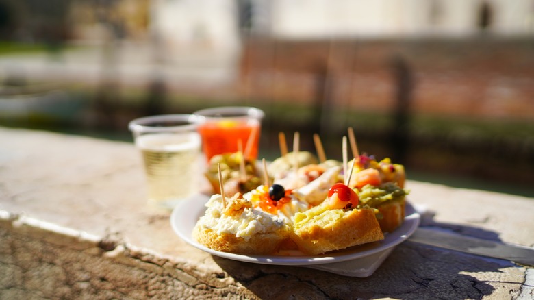 Plate of cicchetti on canal wall