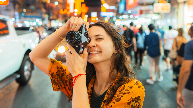 tourist taking photo on street