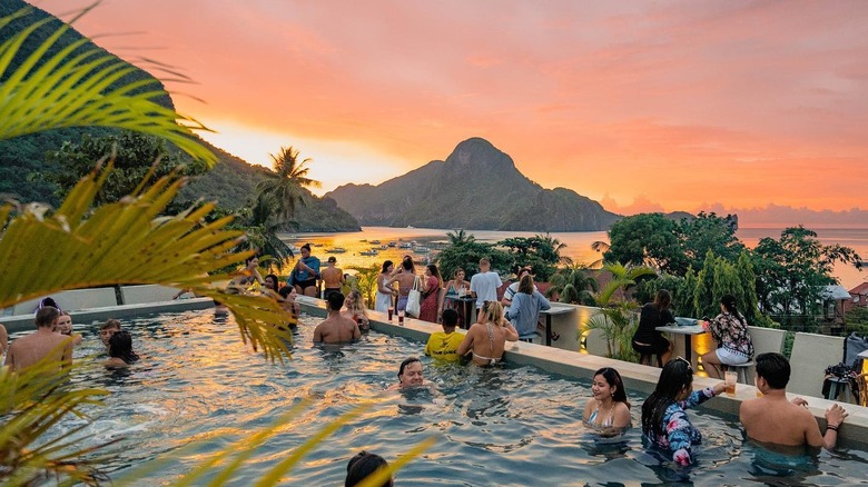 Travelers watching sunset