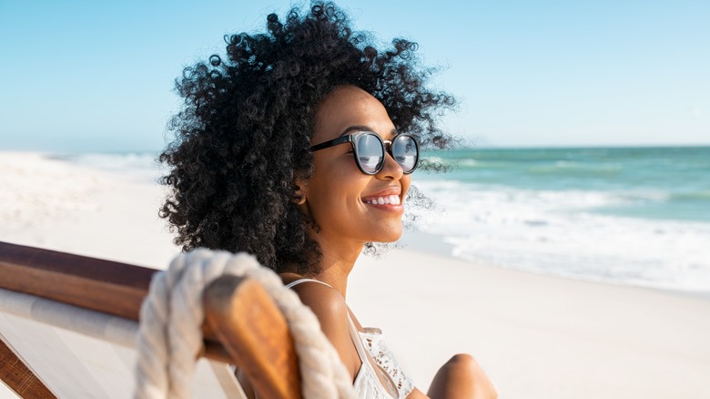 Young woman sitting on beach