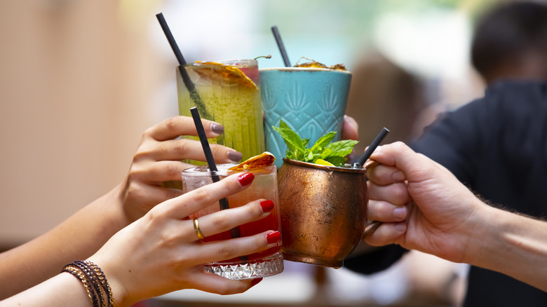 People cheersing cocktails