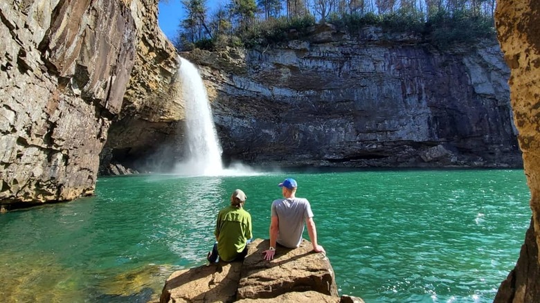 people looking at waterfall