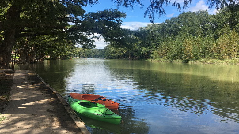 Kayaks floating on Frio River