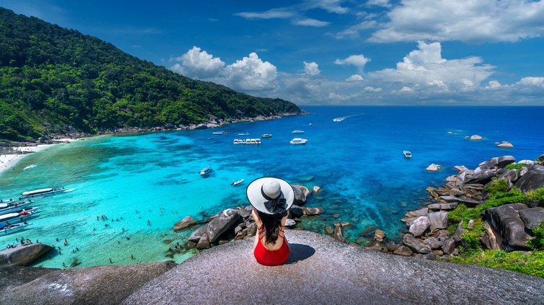 Woman on rock overlooking Similan Islands