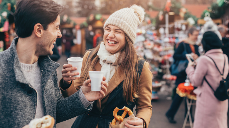 Couple with hot drinks