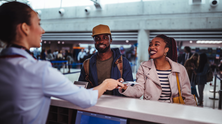 couple checking in at airport