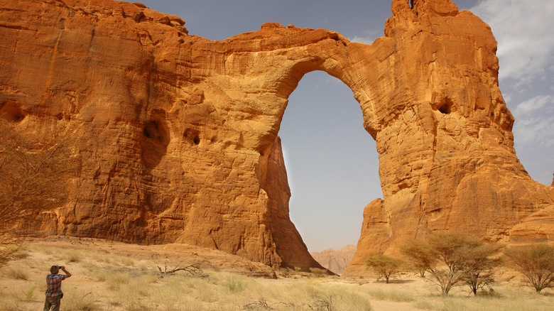 Tourist photographing Aloba Arch