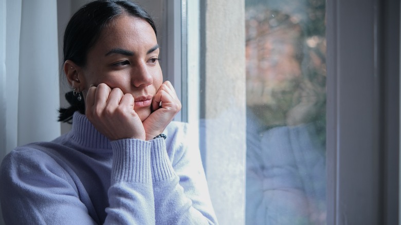 Woman looking out the window