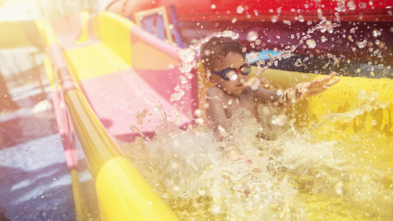 Kid splashing water slide