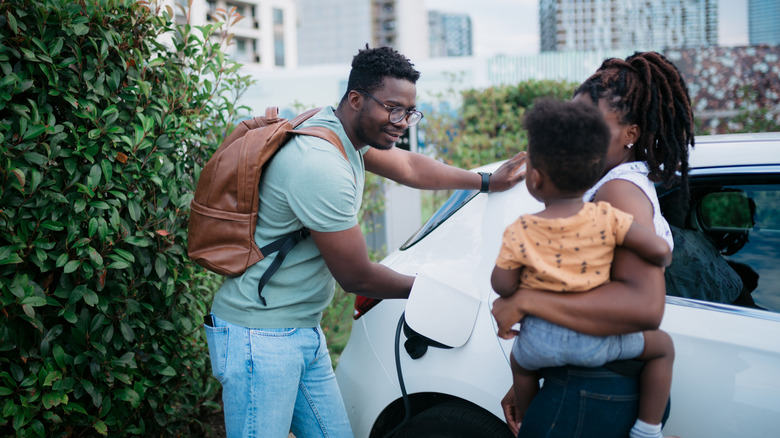 Family charging their electric vehicle