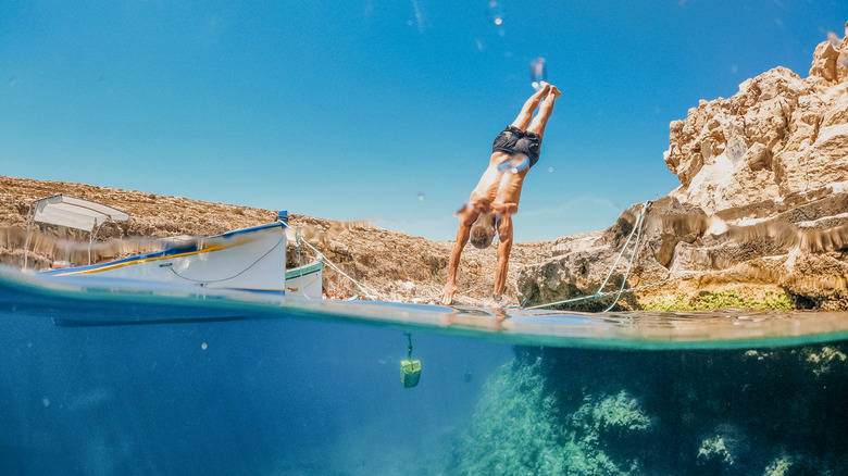 Man cliff jumping