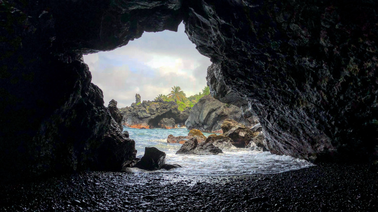 Lava tube on black sand beach