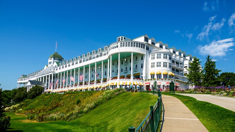 Experience a Horse-Drawn Carriage Arrival at a Midwest Island Hotel with a 660-Foot Porch and Timeless Charm