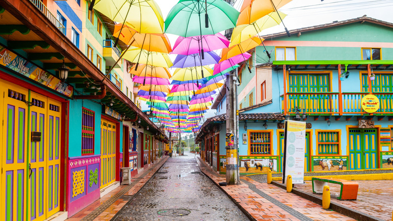 In This Enchanting Colombian Town, Every Building Radiates With Vibrant Colors, Nestled Beside a Turquoise Lake
