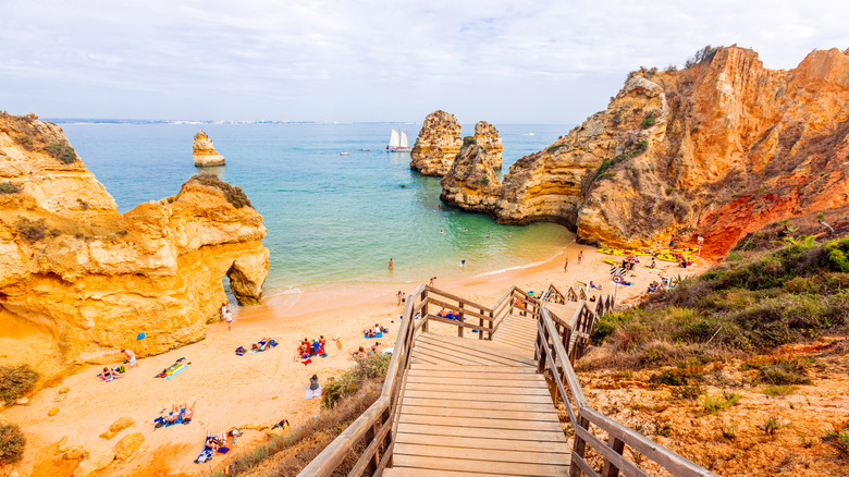 One of Portugal's Most Stunning Beaches: A Breathtaking Cliff-Backed Cove Accessible Only by Stairs
