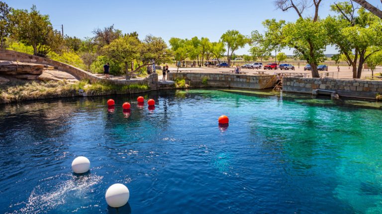 In the Heart of New Mexico's Desert Lies a Tranquil Swimming Hole with Enchanting Blue Waters