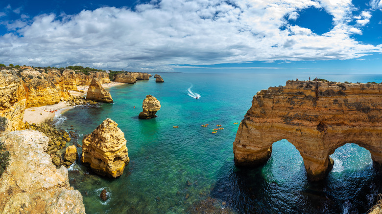 Discover Portugal's Stunning Beach with Clifftop Trails and Turquoise Waters