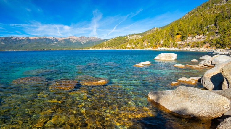 California's Lakeside Paradise Glimmers with Hidden Trails, Sunlit Rocks, and Clear Blue Skies